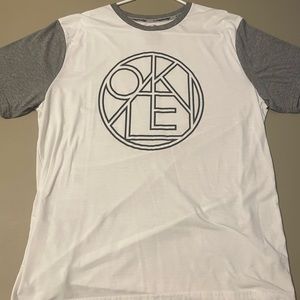 White/gray shirt with graphic Oakley design